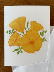 a white card with a watercolor illustration of 4 orange poppy flowers with green leaves,