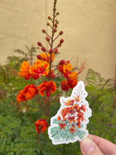 Load image into Gallery viewer, Hand holding a red bird of paradise sticker next to a real red bird of paradise flower showing how similar the artwork looks to the real flower